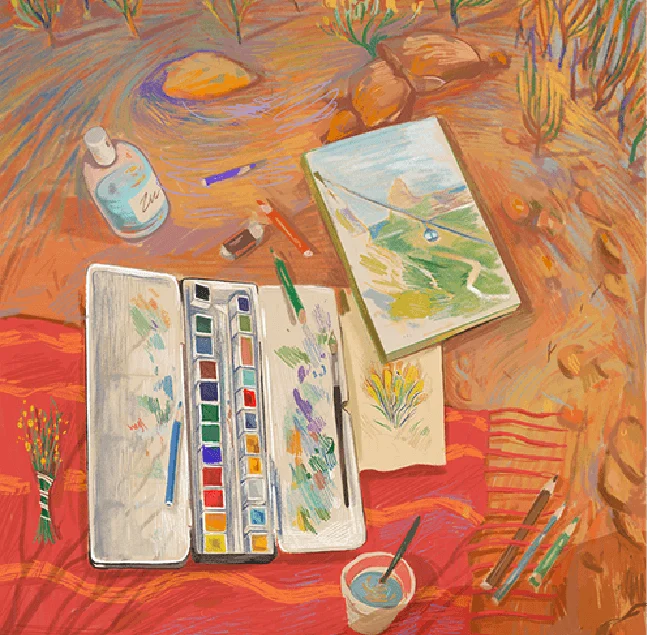 Boîte d’aquarelle et carnet de croquis posés sur une table
